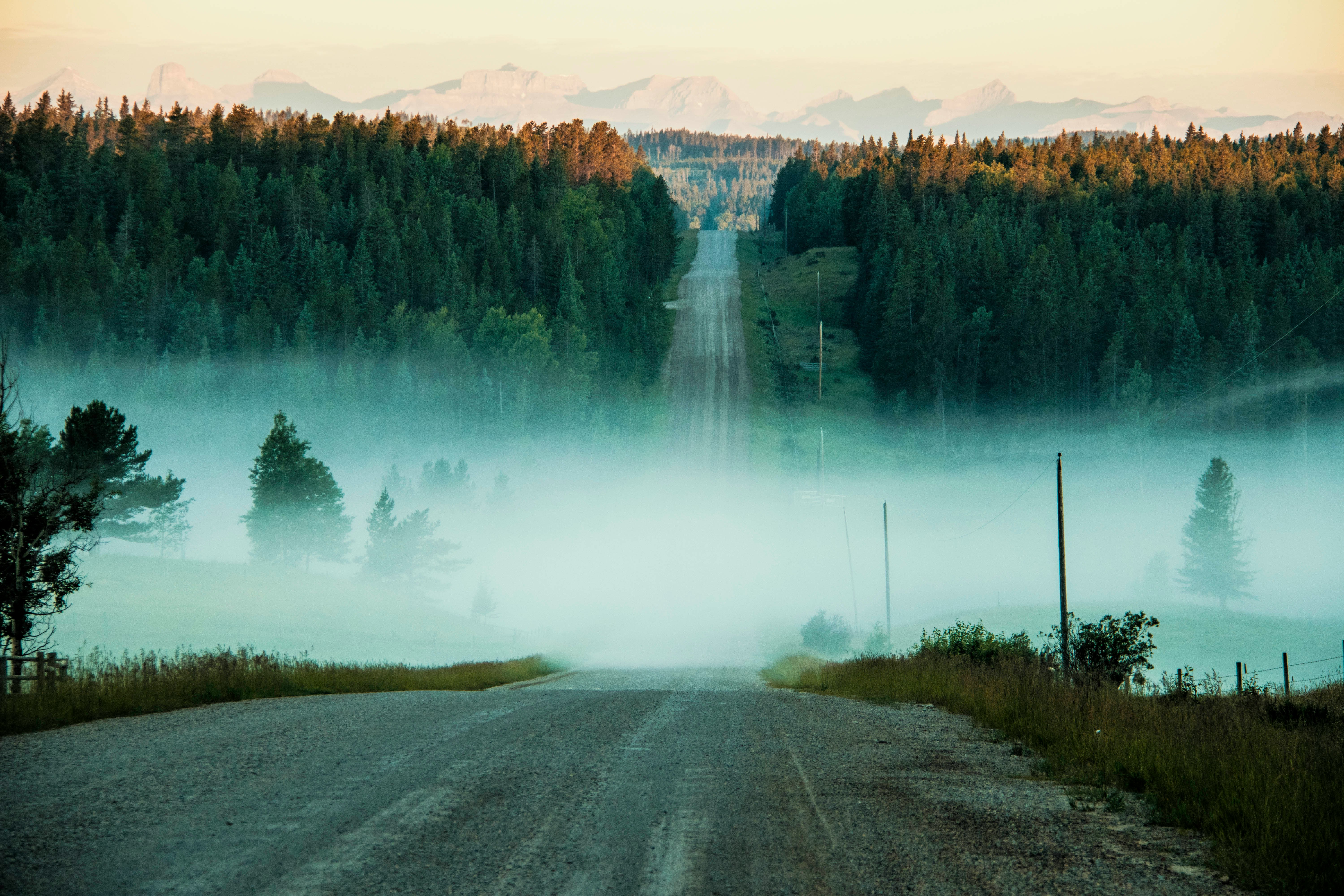 photo of concrete road towards mountain